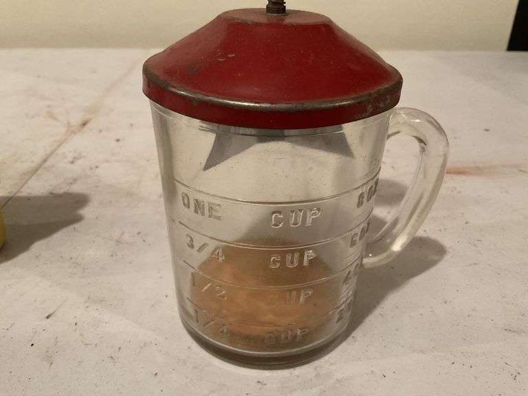 Measuring cup holder, two nut grinders,