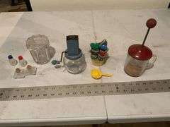 Measuring cup holder, two nut grinders,