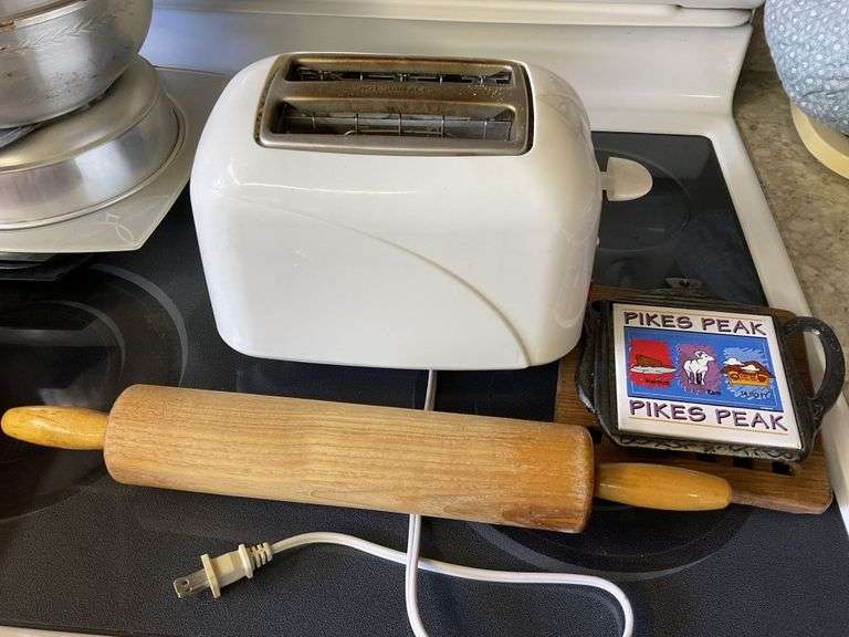 Toaster, rolling pin, and trivets - Legacy Auction Company