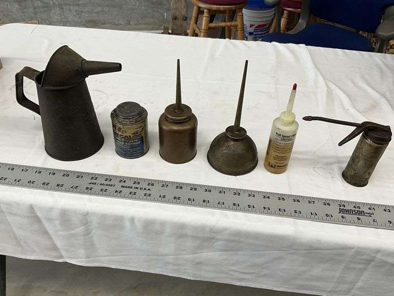 Assorted oilers and oil can
