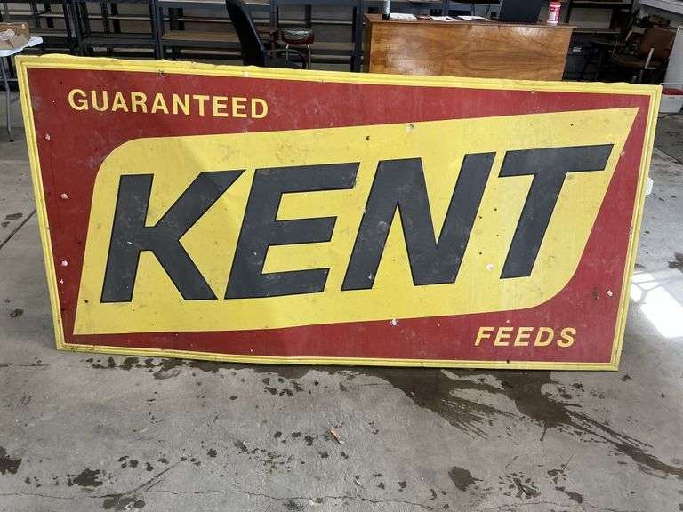 "Guaranteed Kent feeds" metal sign 94“ x 46“