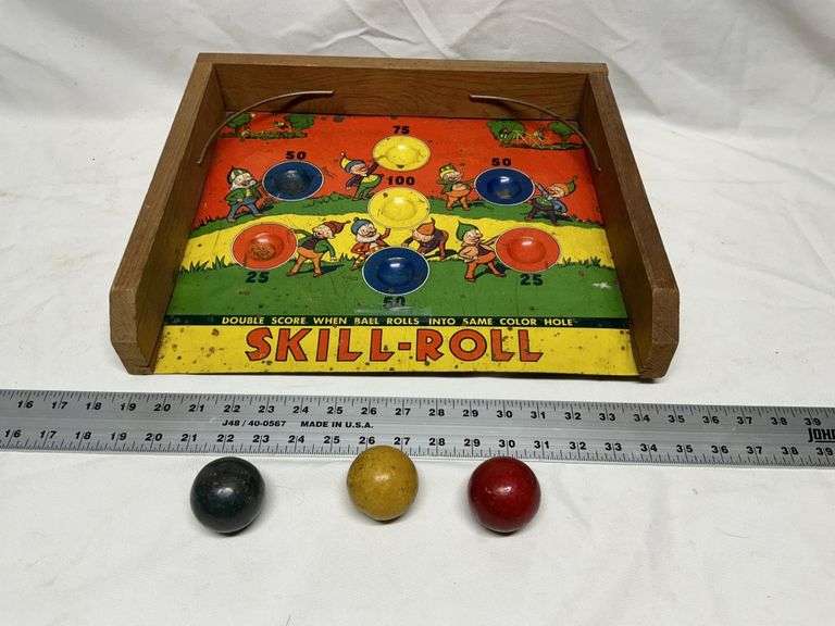 Vintage 1950s tin skill roll game