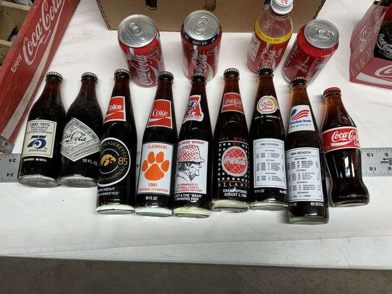 Coca-Cola bottles, some full!