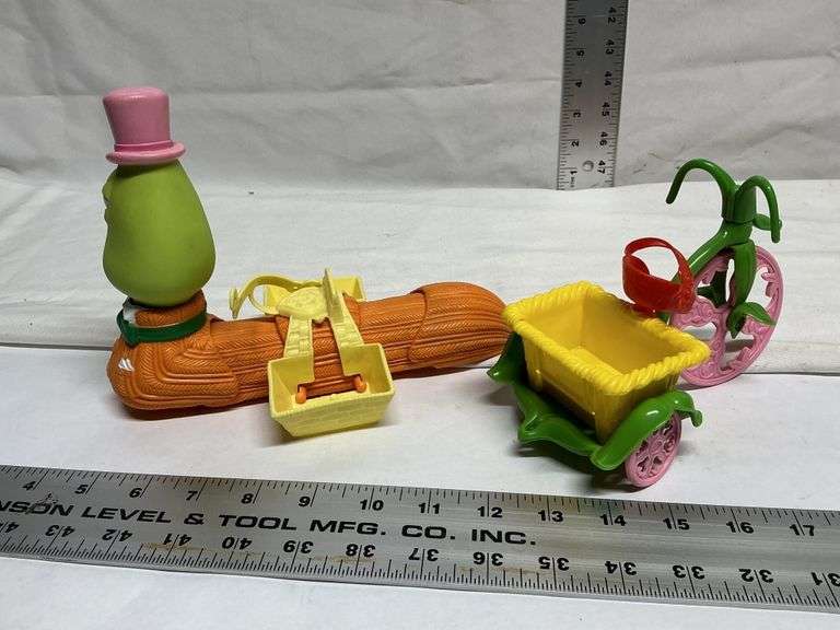 1982 Strawberry Shortcake tricycle and worm.