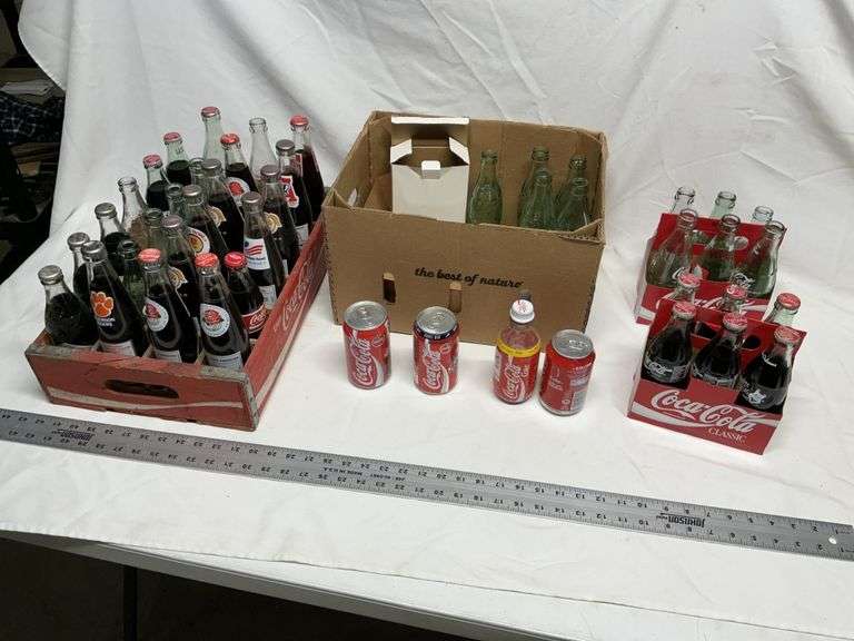 Coca-Cola bottles, some full!