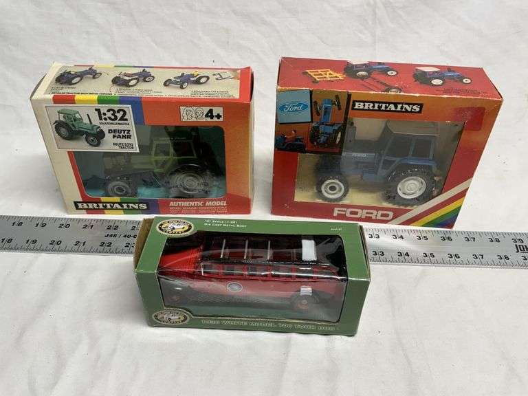 706 tour bus and Ford 710 tractor