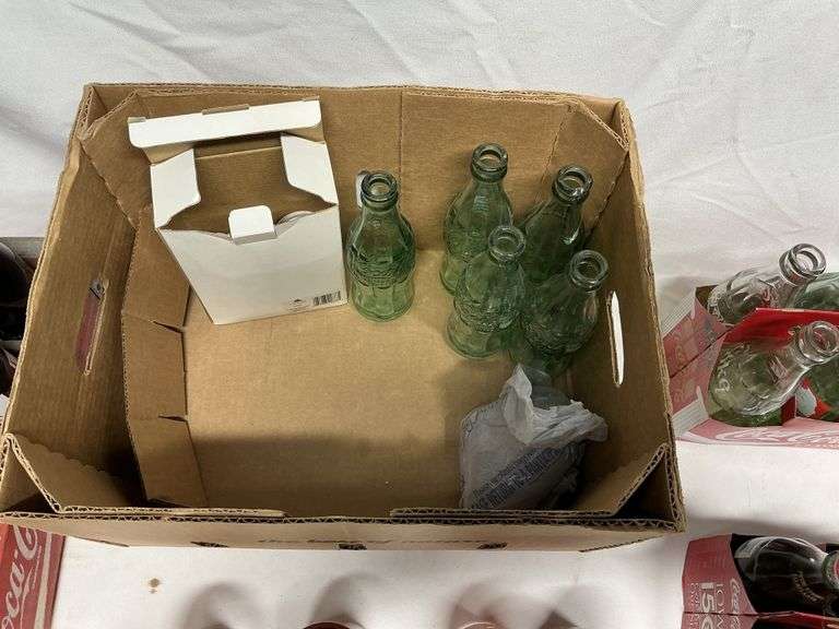 Coca-Cola bottles, some full!