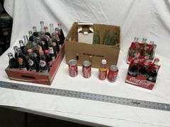 Coca-Cola bottles, some full!