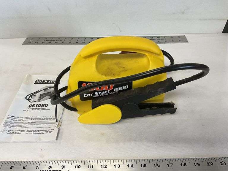 Portable jump starter with flashlight