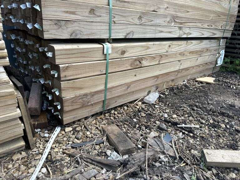 (65) treated 4" x 4" x 8' lumber