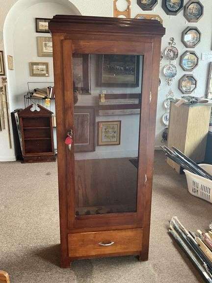 Wooden gun cabinet 25 x 62 x 12, has key