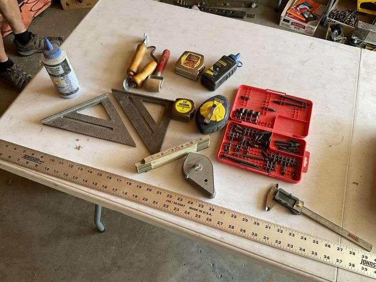 Squares, tape measures, and assorted tools
