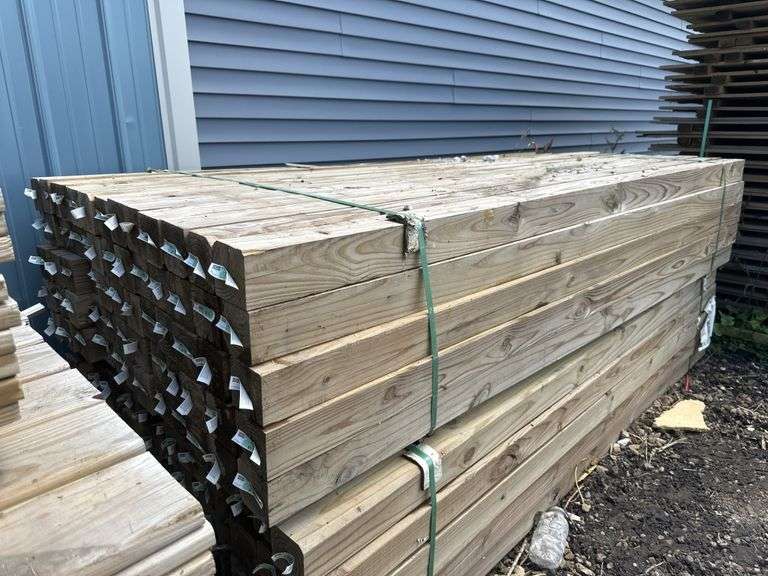 (65) treated 4" x 4" x 8' lumber