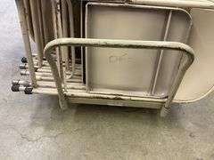 Approx. 64 folding metal chairs and cart