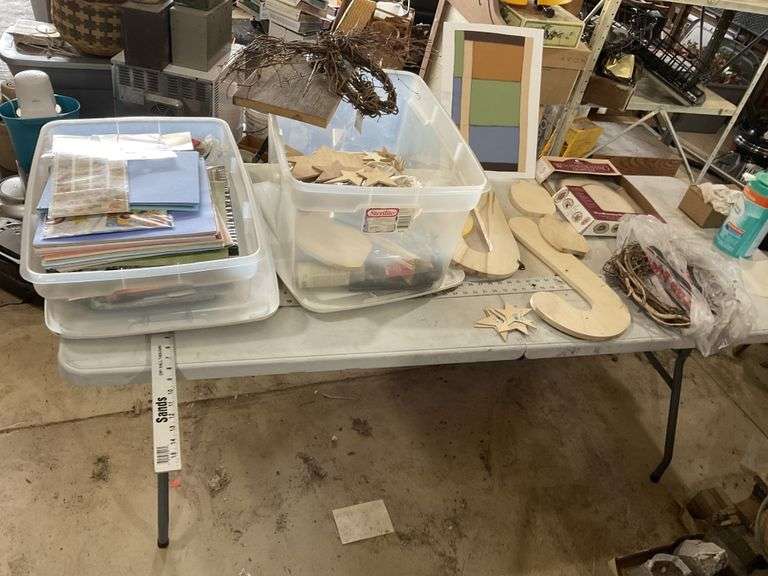 Crafting supplies with totes and lids.