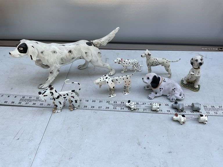 Assorted dog figurines and sweet corn holders.
