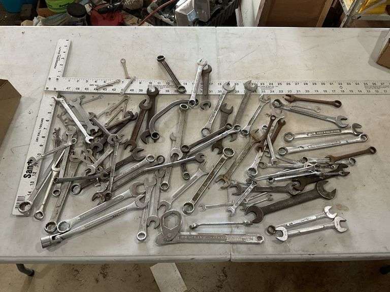 Combination wrenches including craftsman