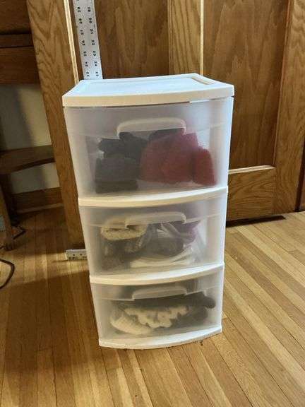 Organizer drawers with ladies hats and mittens