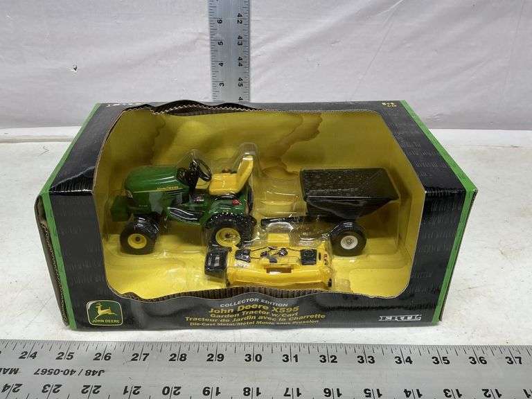 John Deere X595 garden tractor with cart - Legacy Auction Company