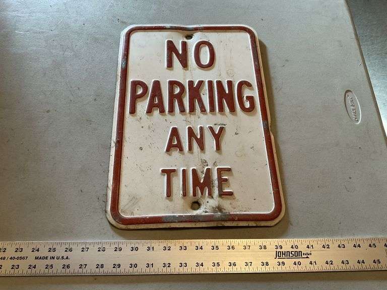 Embossed No Parking sign
