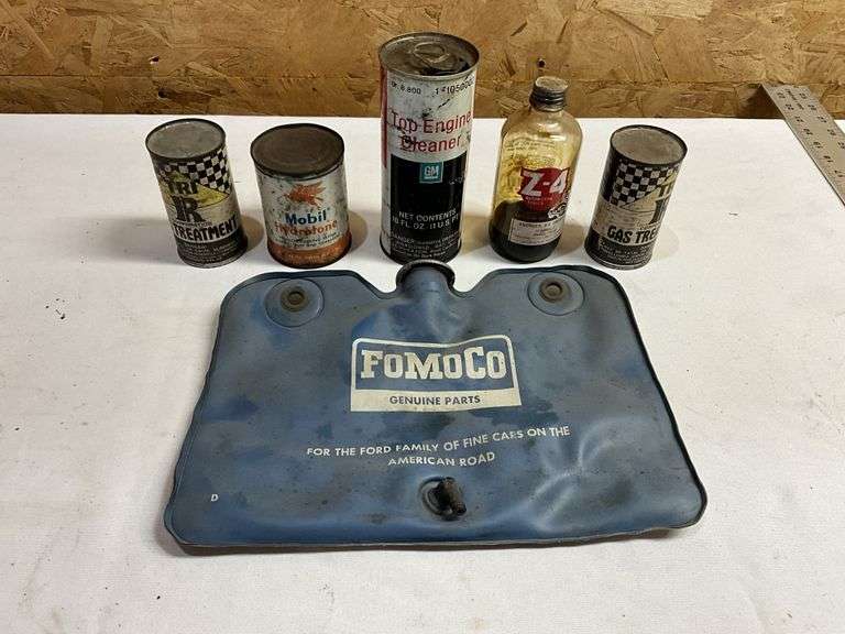 Vintage Ford part and vintage assorted cans