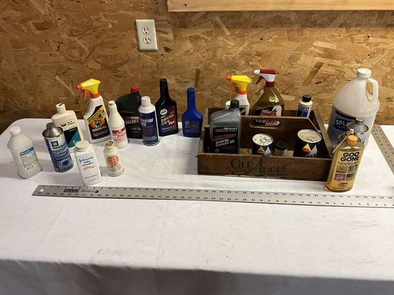 Assorted shop fluids, and grass seed with wooden