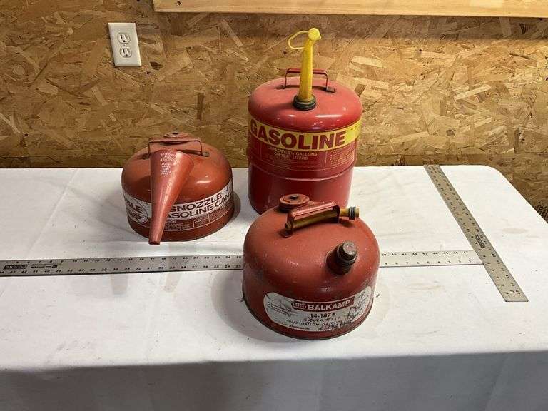 3-steel gas cans. Some gas in them.