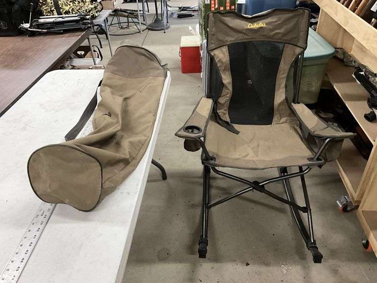Cabela’s folding rocking chair with bag. Bag has - Legacy Auction Company