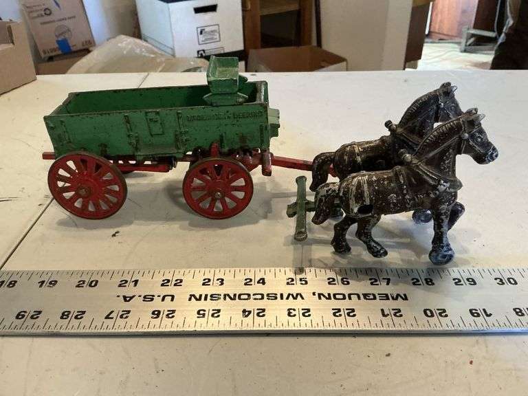 Antique cast McCormick Deering wagon with horses