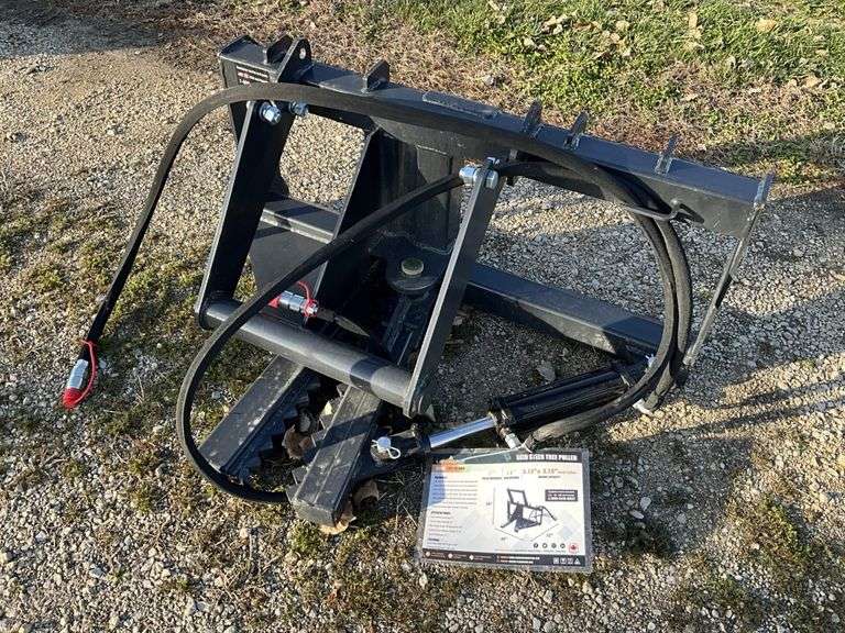Land Honor skid loader tree puller attachment - Legacy Auction Company