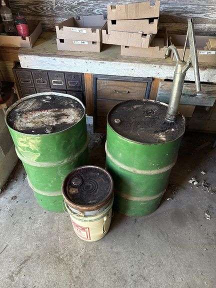 Barrels and oil pump, partially full of oil!