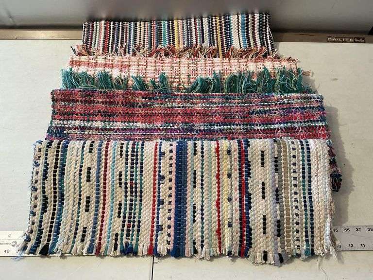 Used Throw Rug (4) throw rugs - Legacy Auction Company