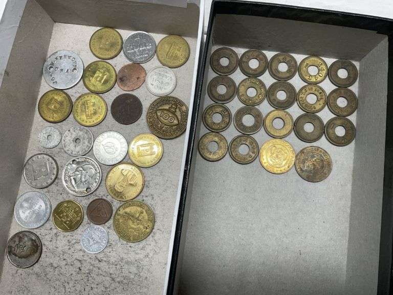 Assorted tokens including tax tokens Legacy Auction Company