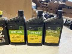 John Deere motor oil/transmission oil/2 cycle oil - Legacy Auction Company