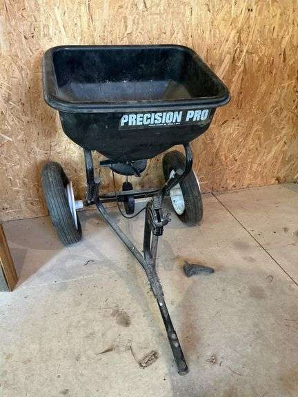 Pull behind broadcast spreader