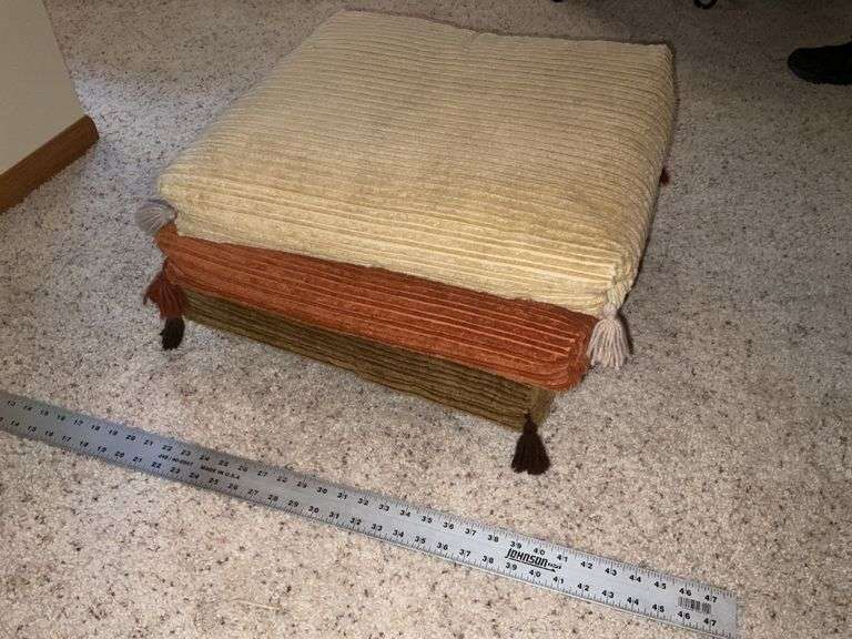 Footstool/pillow set on casters
