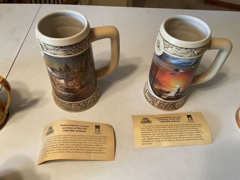 Assorted beer steins and shaving mug