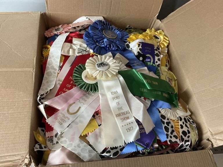 Box of award ribbons - Legacy Auction Company