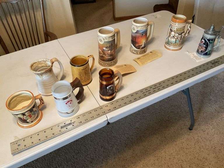 Assorted beer steins and shaving mug