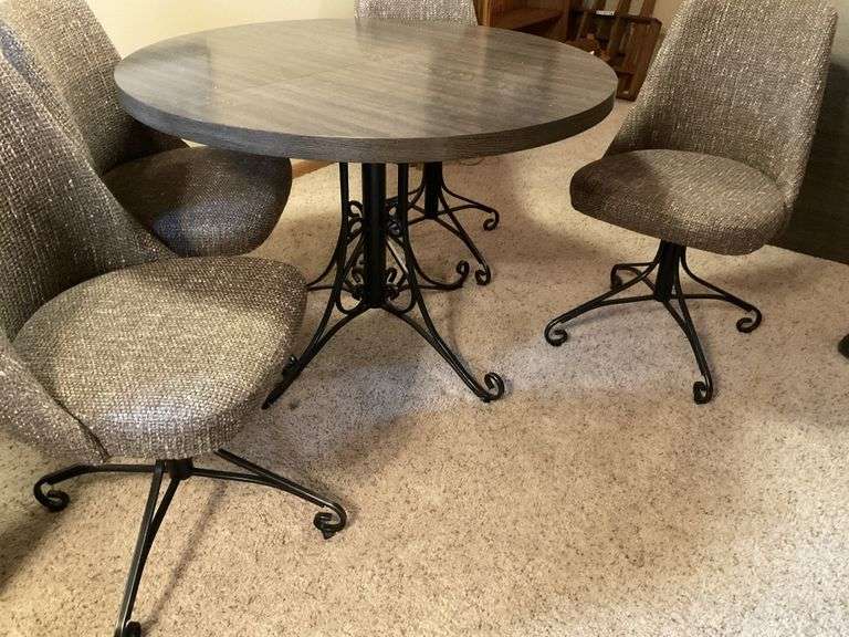40" table, 4- swivel chairs, 1- leaf