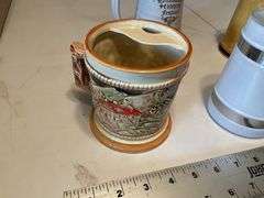 Assorted beer steins and shaving mug