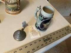 Assorted beer steins and shaving mug