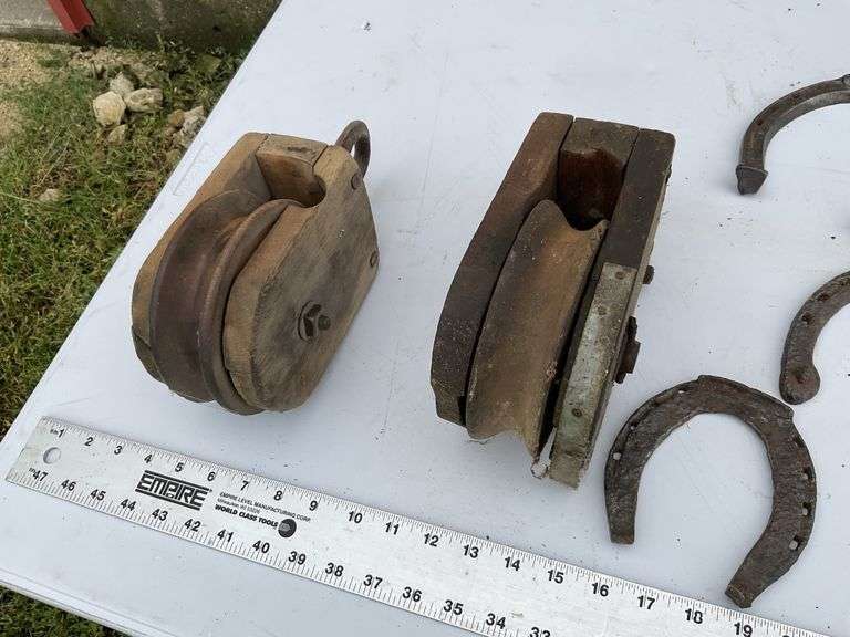 2- wooden pulleys and vintage horseshoes