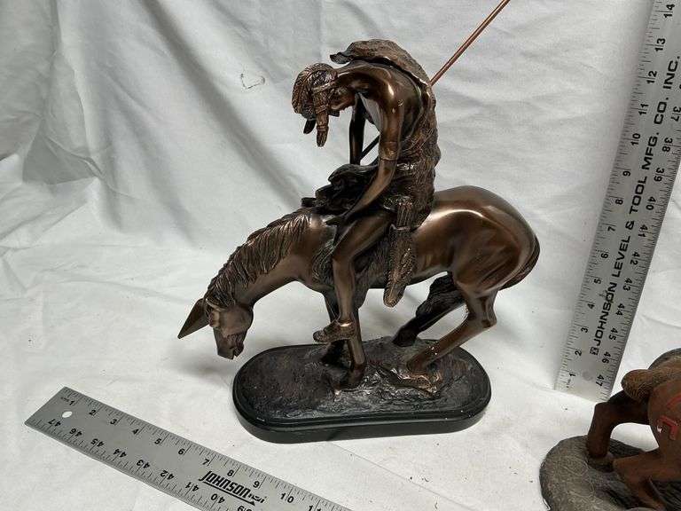 Horse statues, both are missing an ear