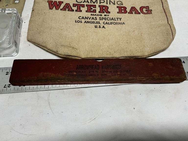 Water bag, jars, cast iron pieces, level, etc