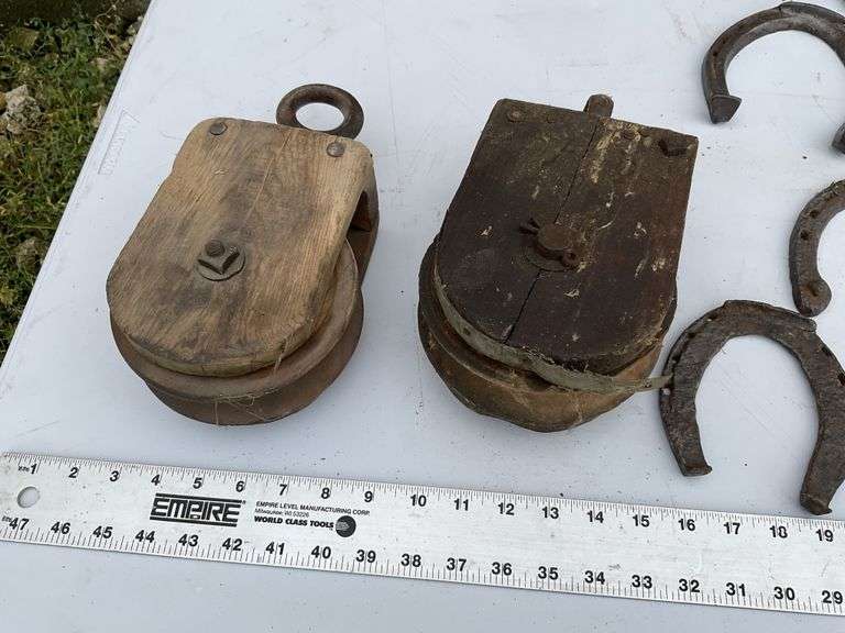 2- wooden pulleys and vintage horseshoes