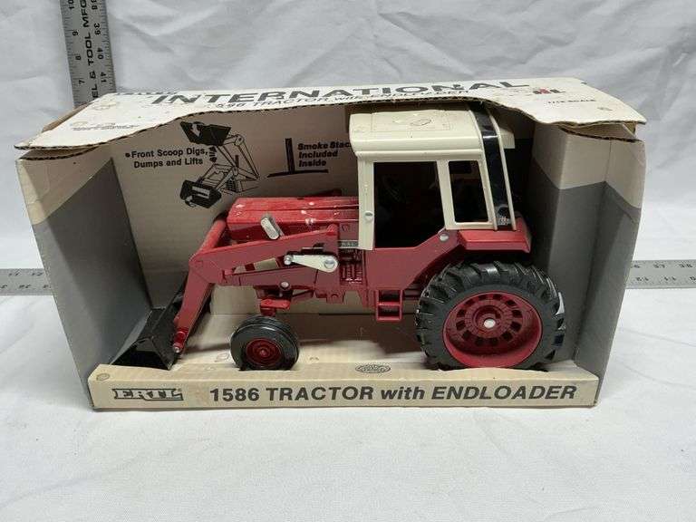 International 1586 tractor with end loader