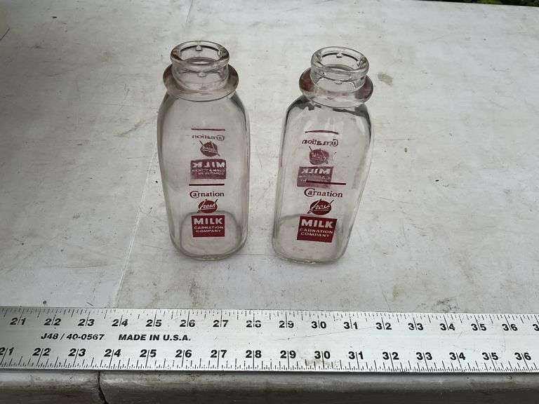 2- Carnation 1-pint milk bottles