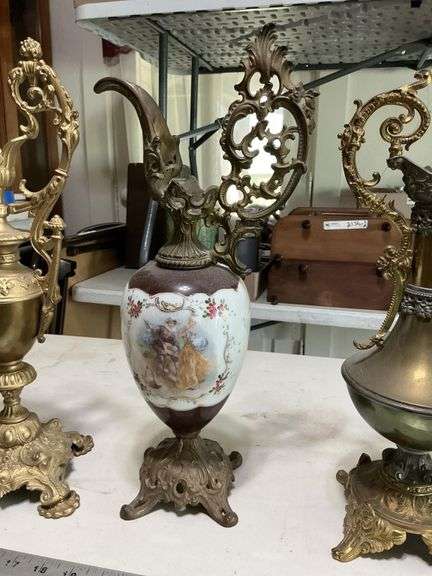 Cast-iron base and heavy decorative pitchers