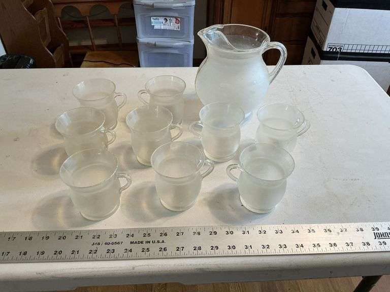 Plastic Kool-Aid pitcher and mugs